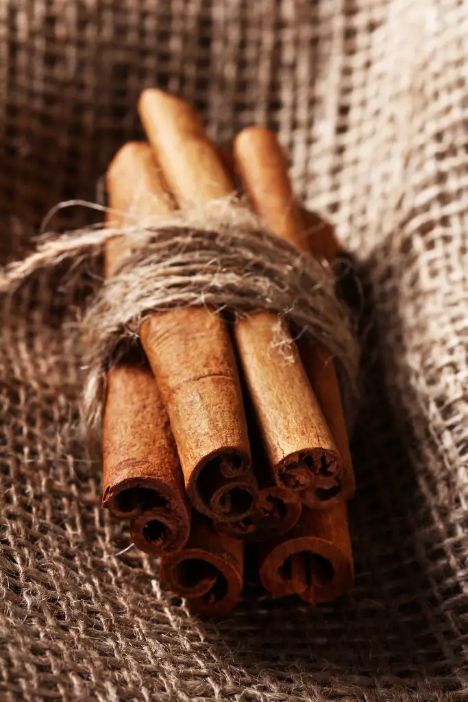 Close up of cinnamon sticks on sack cloth