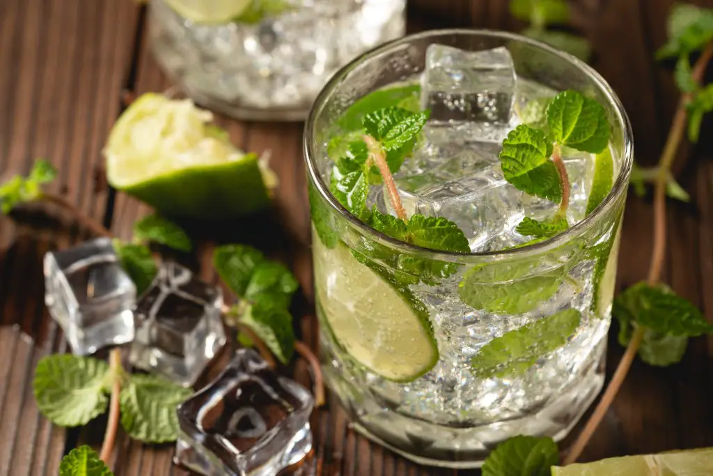 another most popular cocktails a glass of mojito cocktail on wooden table